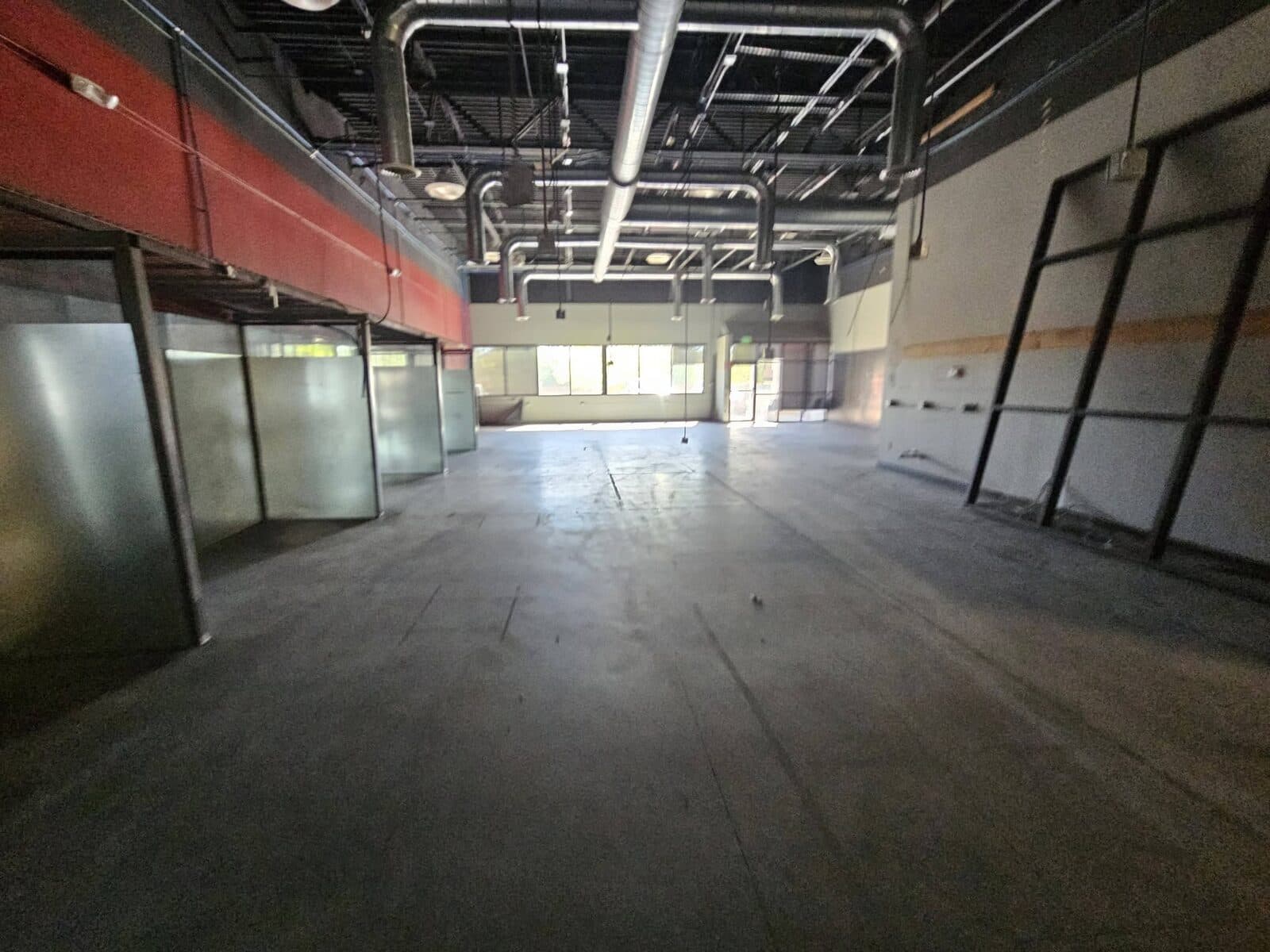 Commercial space with red and white glass partitions