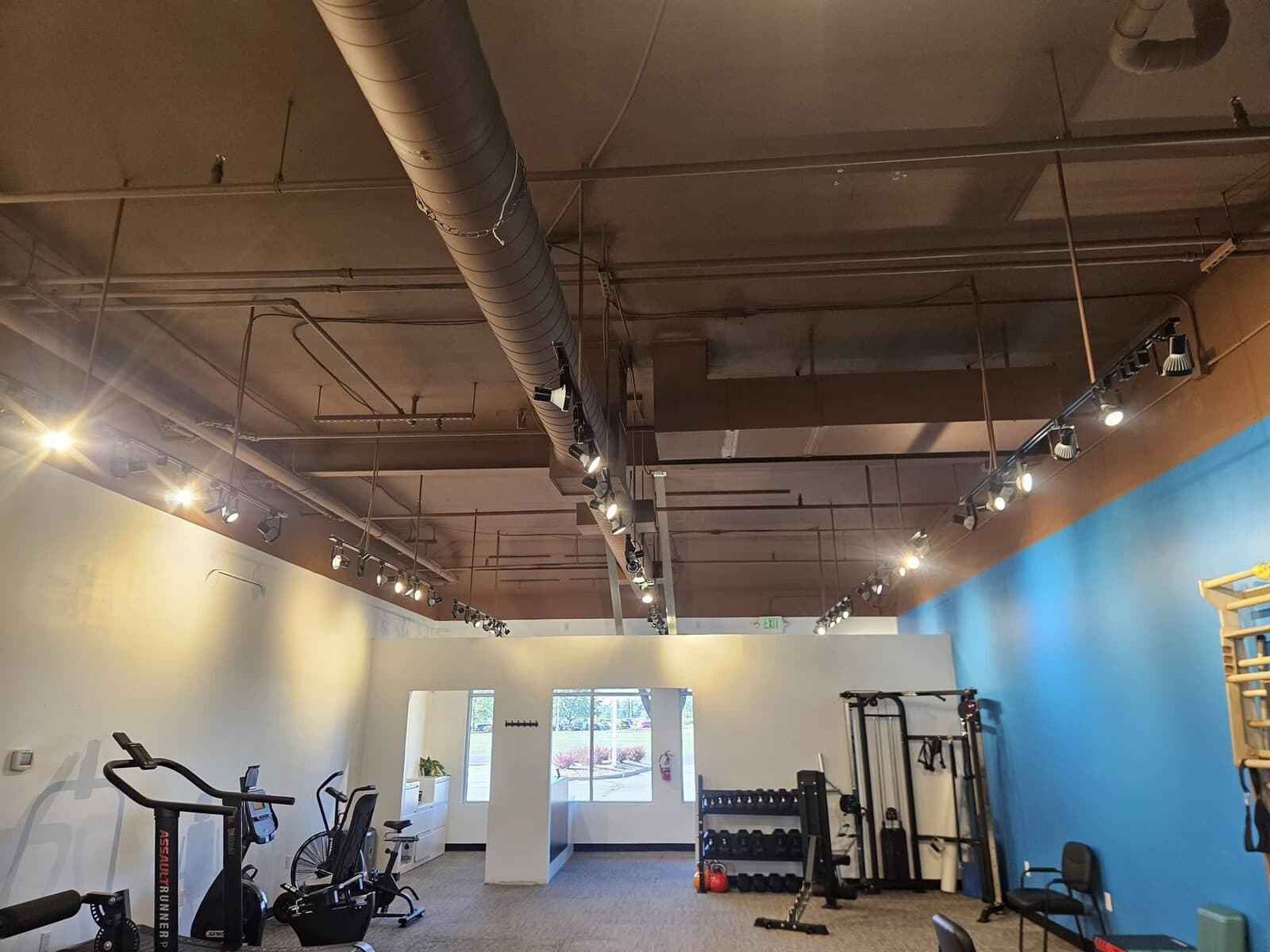 Gym with a bold blue accent wall