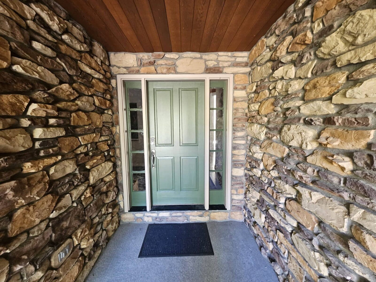 Painted front door in a stone entryway